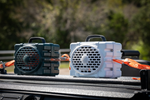 Two Turtlebox speakers strapped down with tie down straps