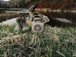 Turtlebox Cub speaker outdoors by the water