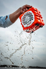 Turtlebox Cub speaker held underwater